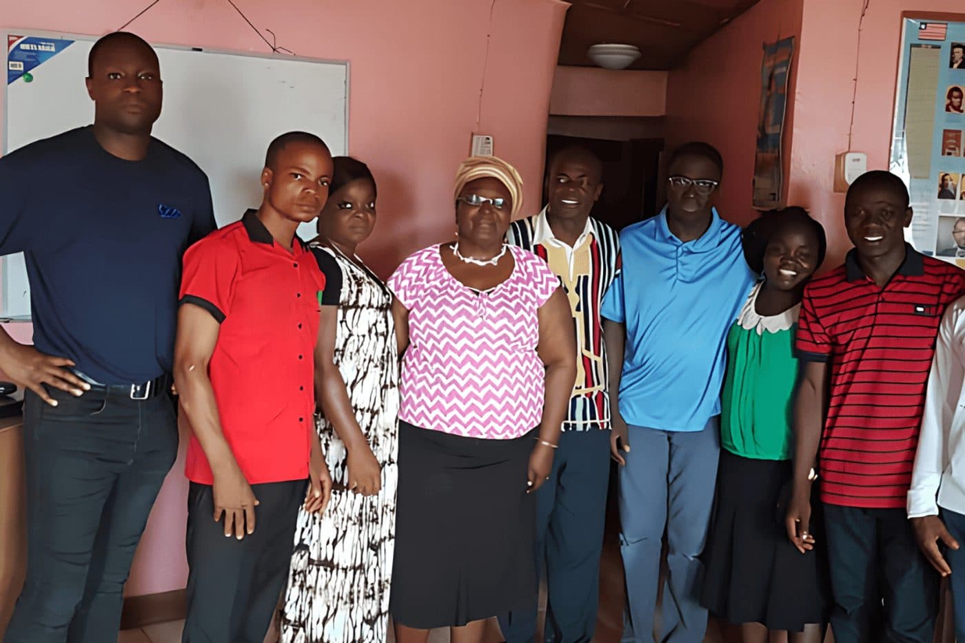 The EFCM team with community members in Manogleh, Liberia