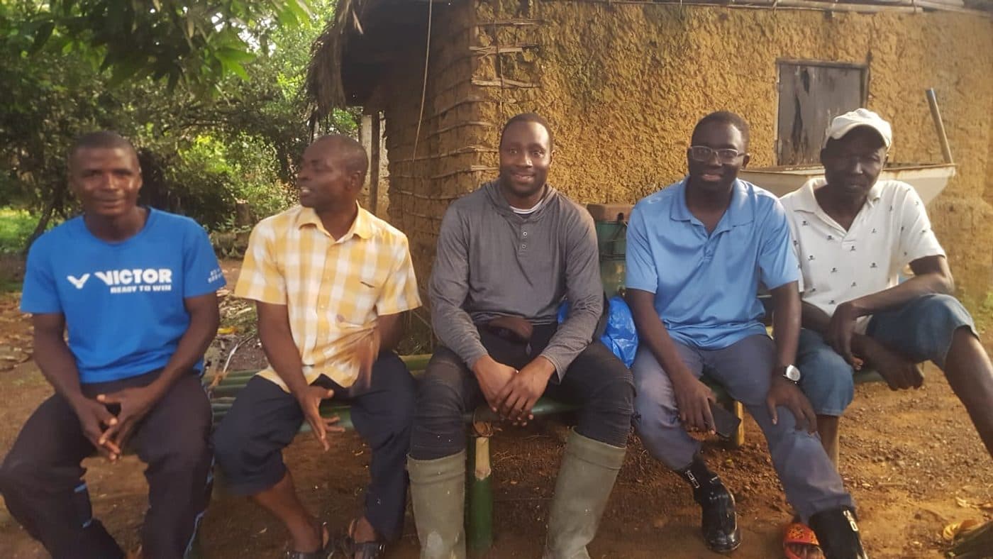 The EFCM team with local men in Tieni, Liberia